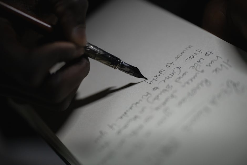 Open notebook beside a closed laptop, suggesting a pastor preferring handwritten sermon work over AI