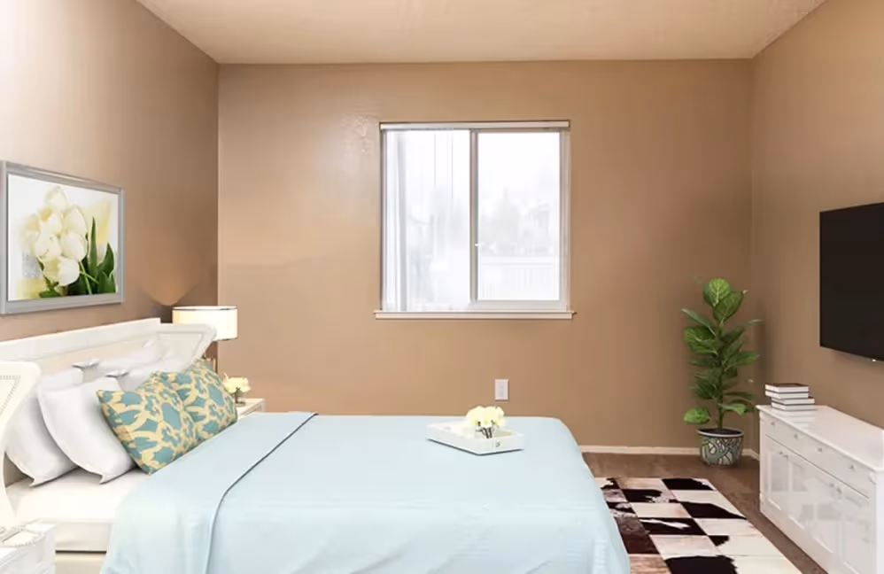 Bedroom with staged furniture