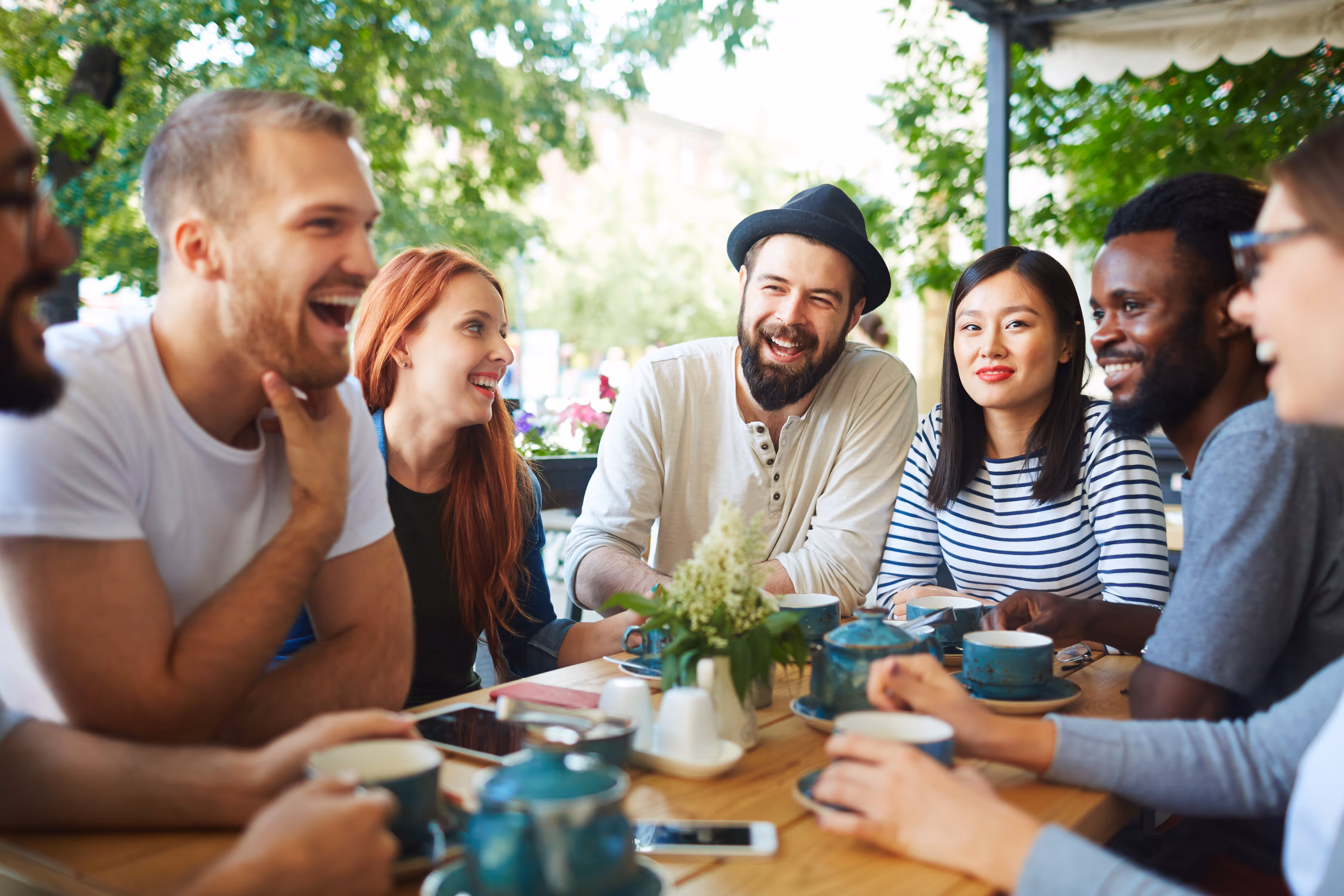 Group of people sitting at a restaurant stock image