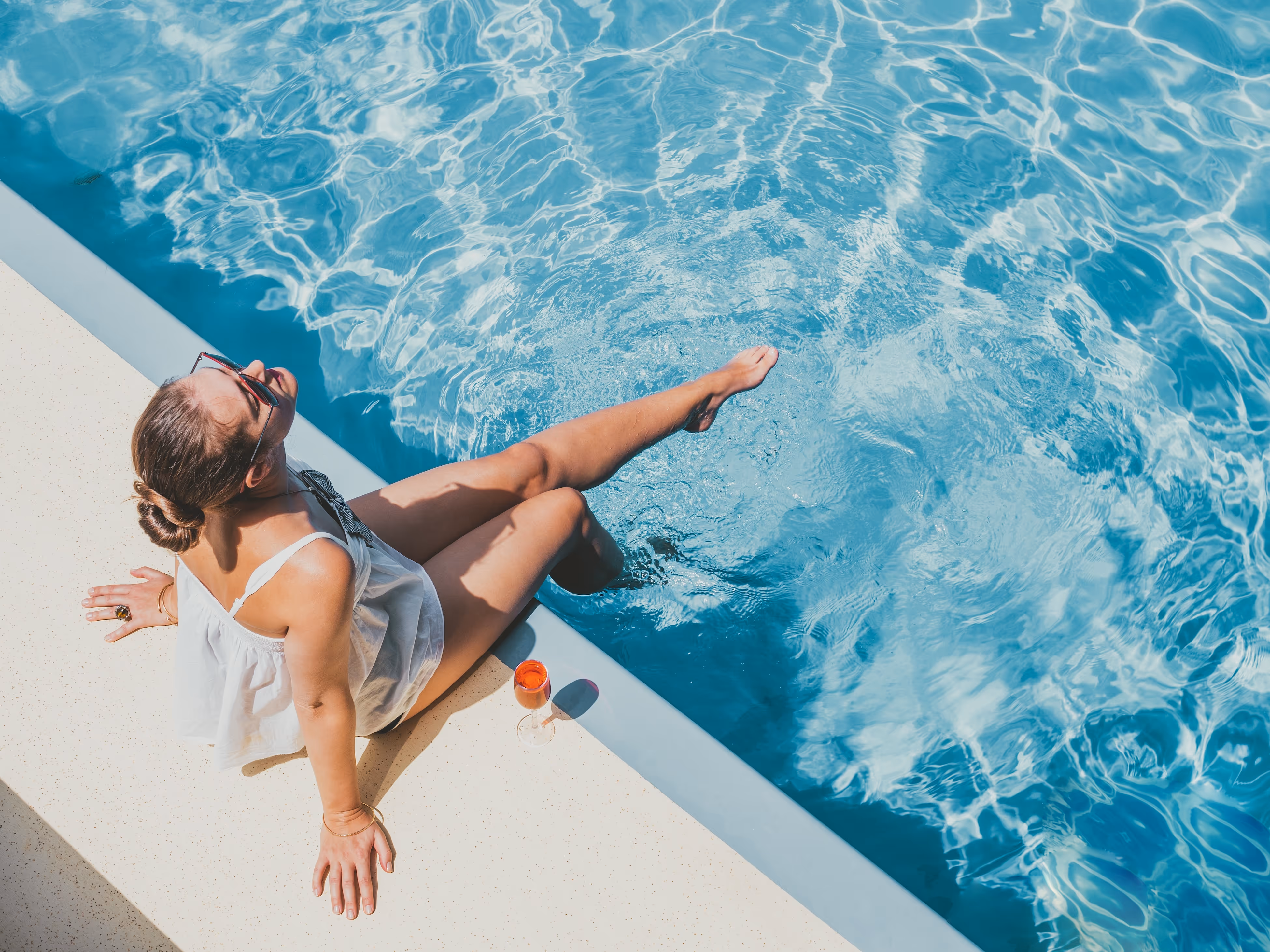 Woman with her legs at the pool stock image