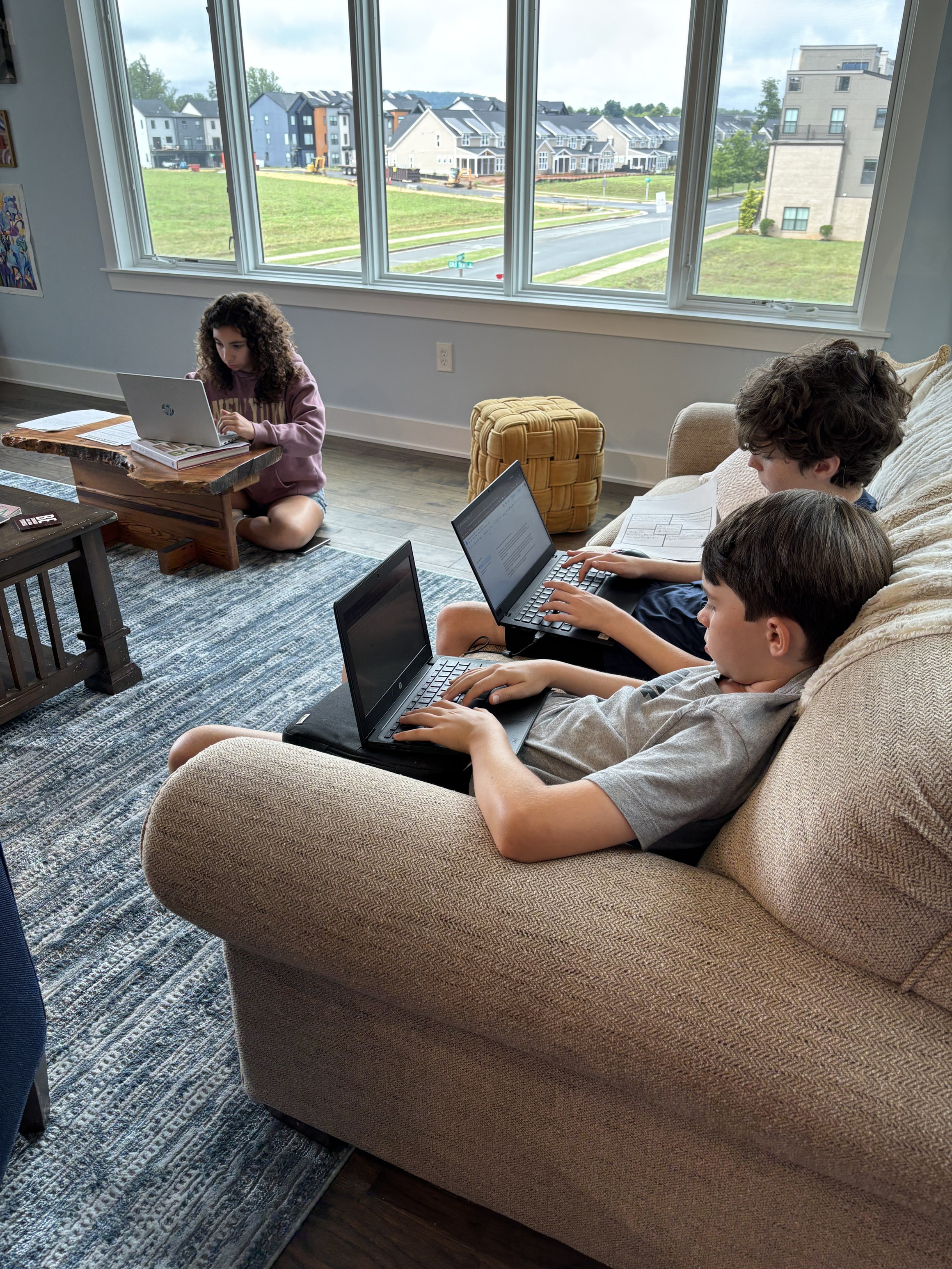Students sitting on couch studying