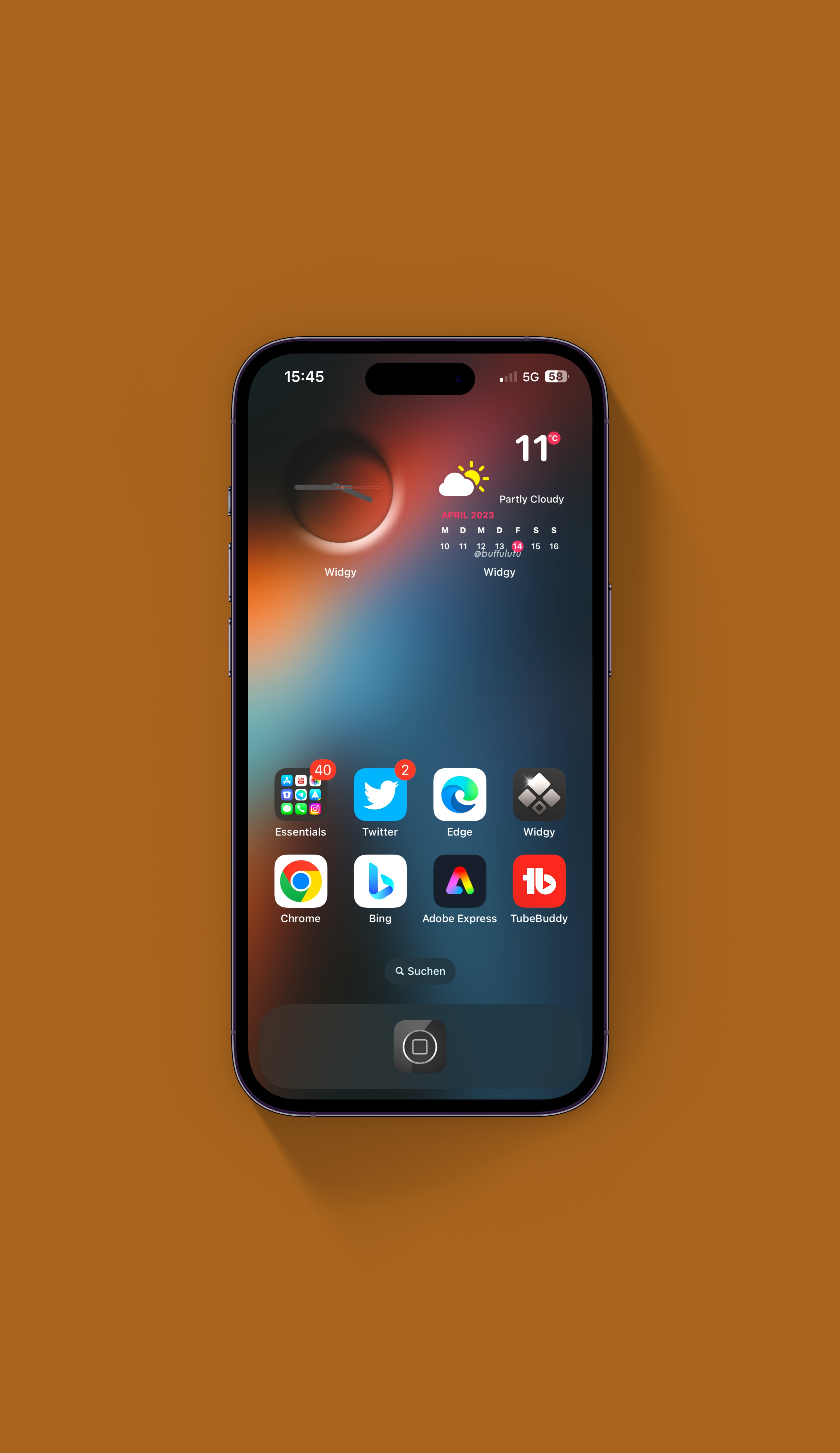 Smartphone displaying apps and widgets including weather, clock, Twitter, Chrome, and Bing on a brown surface.