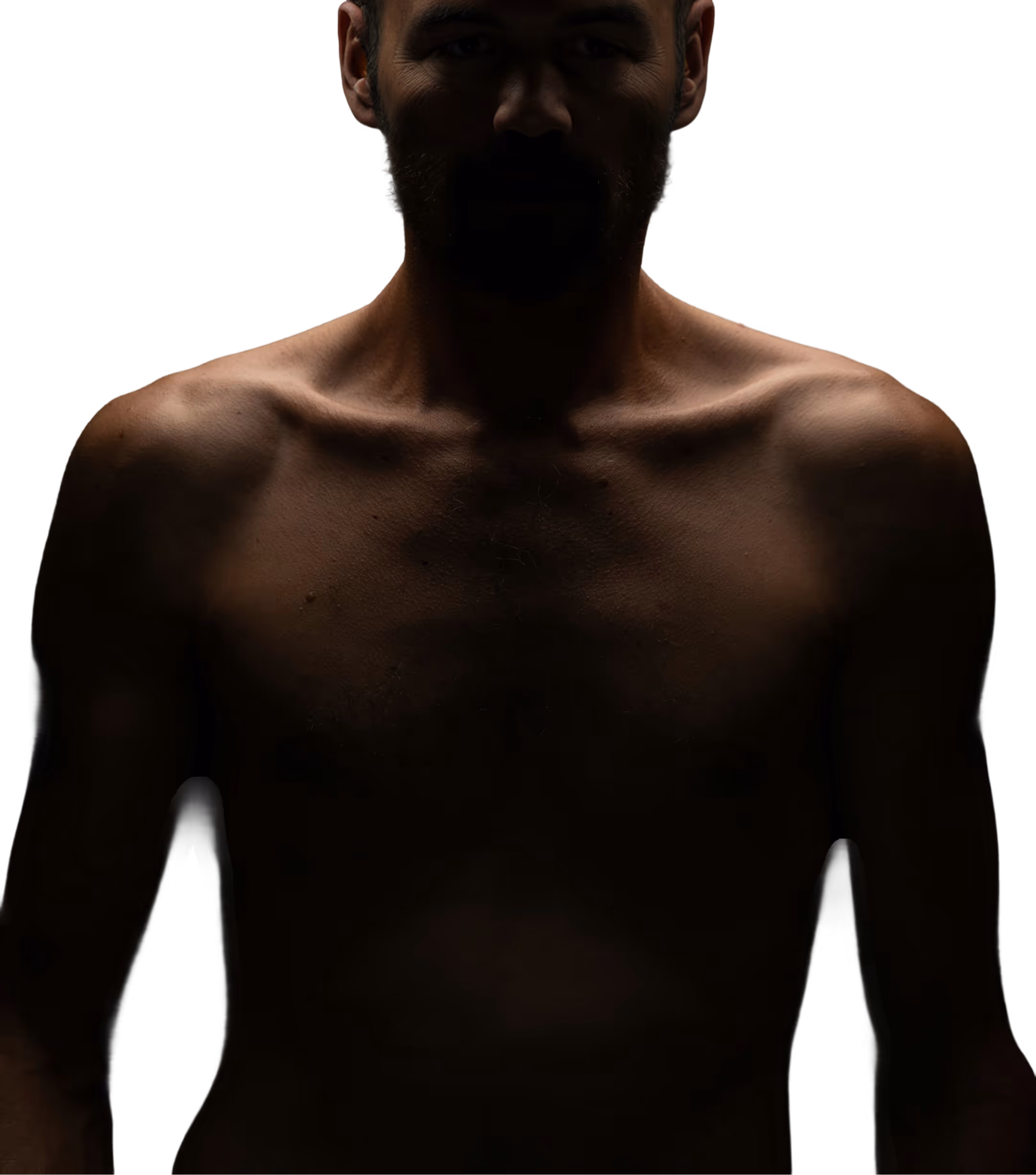 Close-up of a person's torso in low light, evoking strength and focus.
