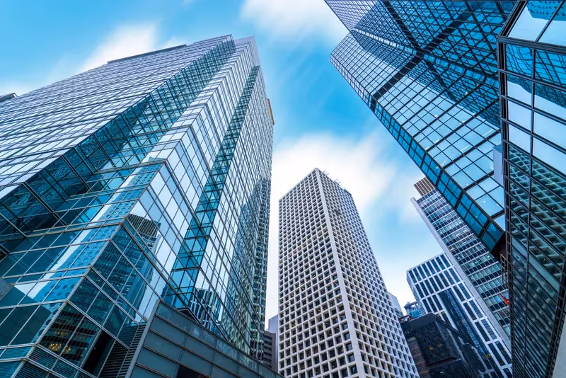 Modern glass office buildings viewed from street level