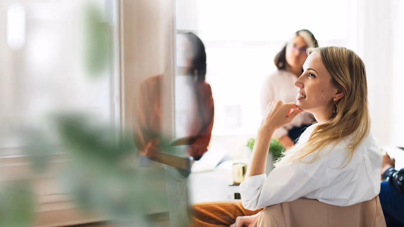 Three colleagues engaged in a business presentation