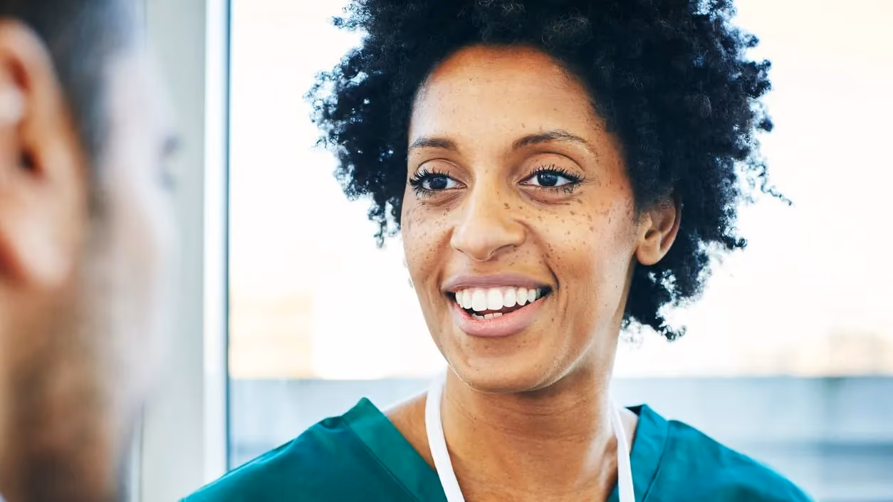 Doctor talking with a person in a healthcare setting