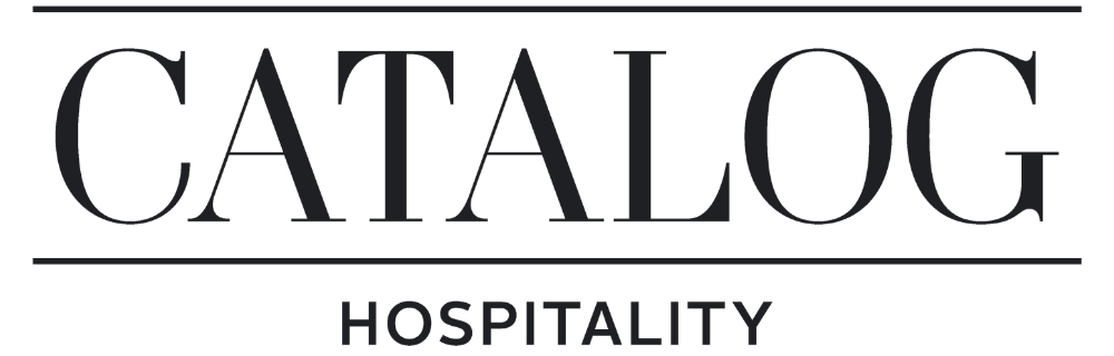 Text logo with the word CATALOG above and HOSPITALITY below, separated by horizontal lines.