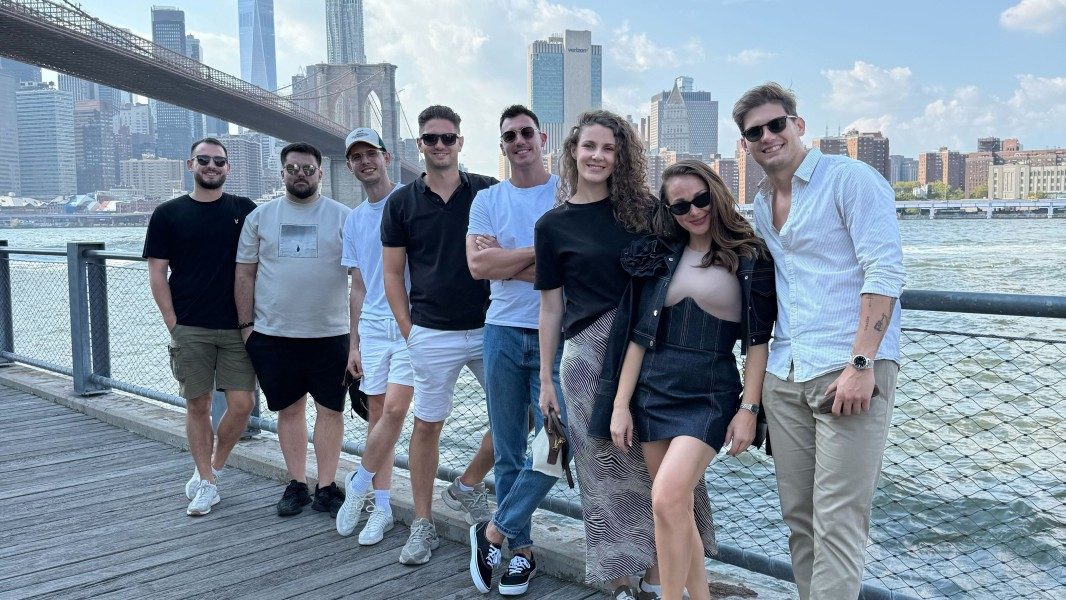 The team under the Brooklyn Bridge in New York