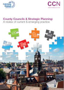 County Councils Strategic Planning report cover with colorful puzzle pieces and cityscape photograph.