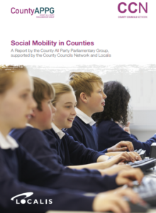 Students in school uniforms using laptops in classroom for County Social Mobility program
