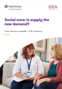 Two women discussing social care supply challenges at a professional conference event