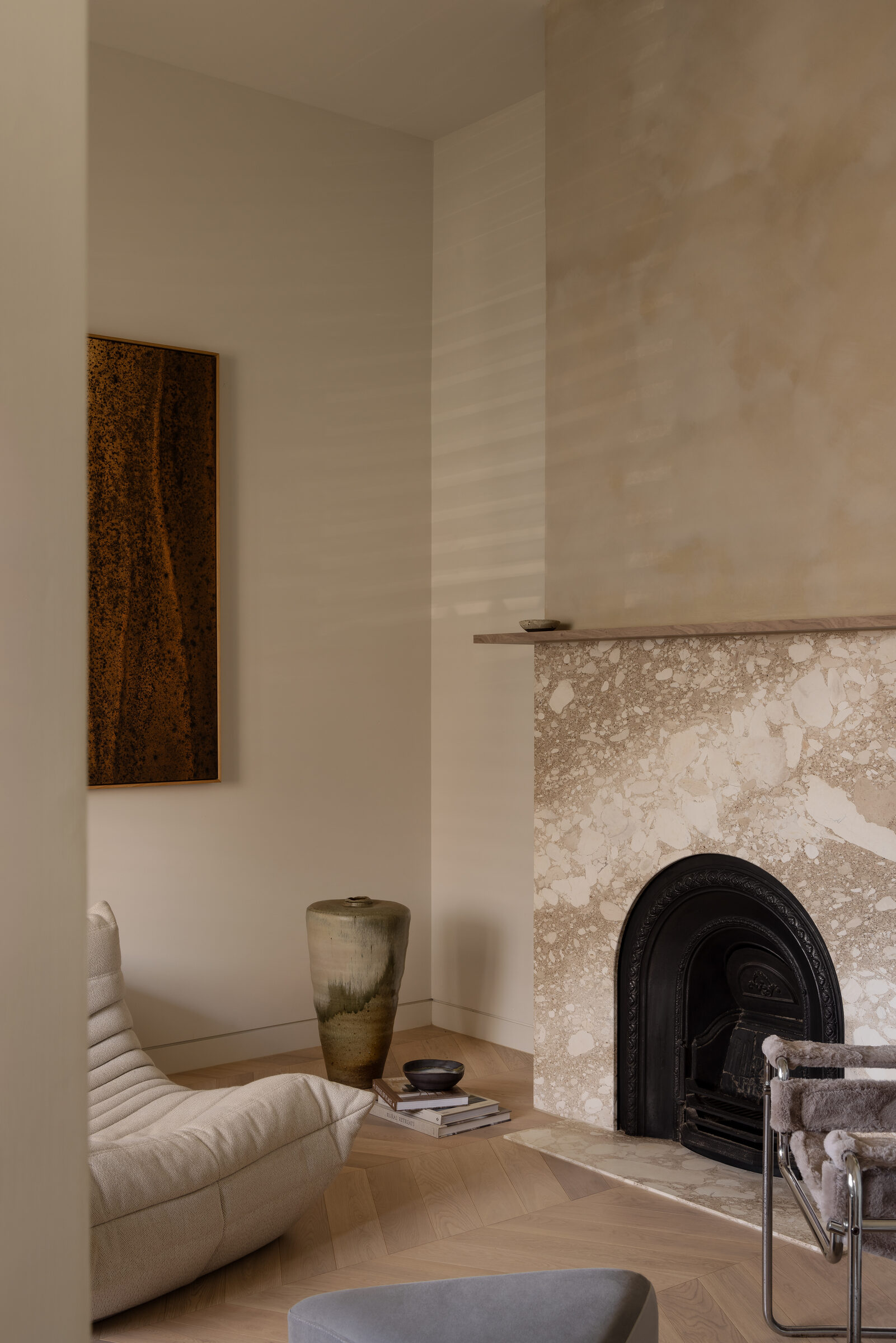Marble fireplace with restored pilasters and decorative vase, Brighton Restoration