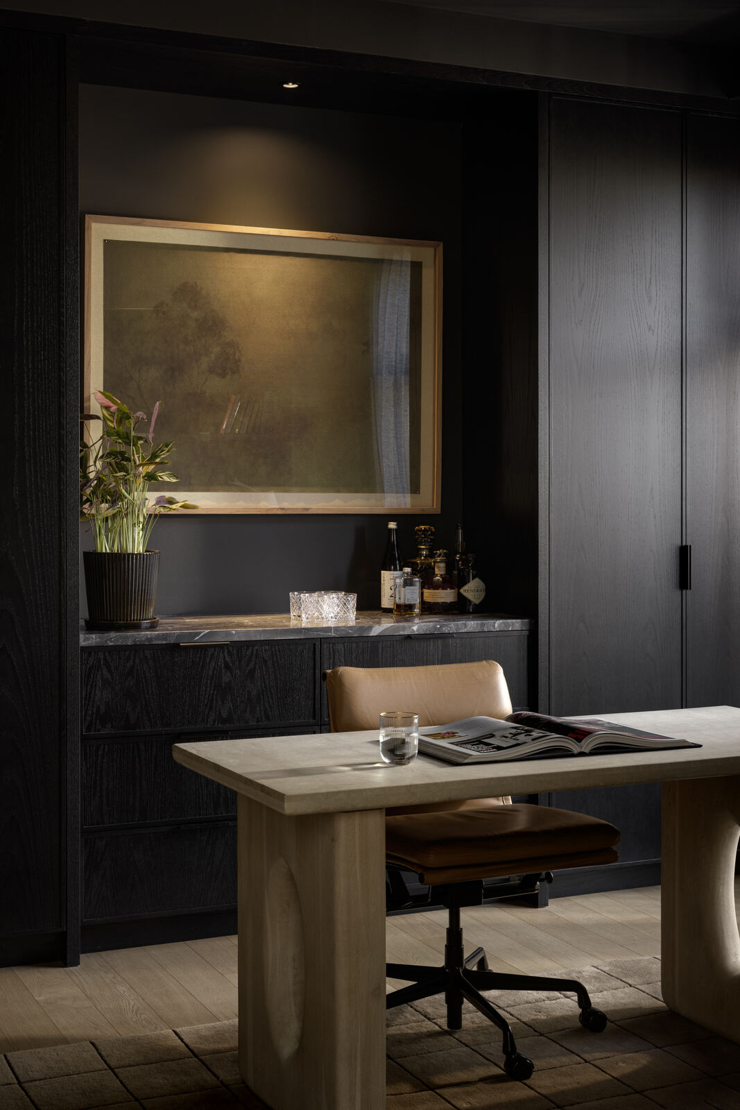 Study with dark joinery, brass framed artwork and leather desk chair, Madison Residence
