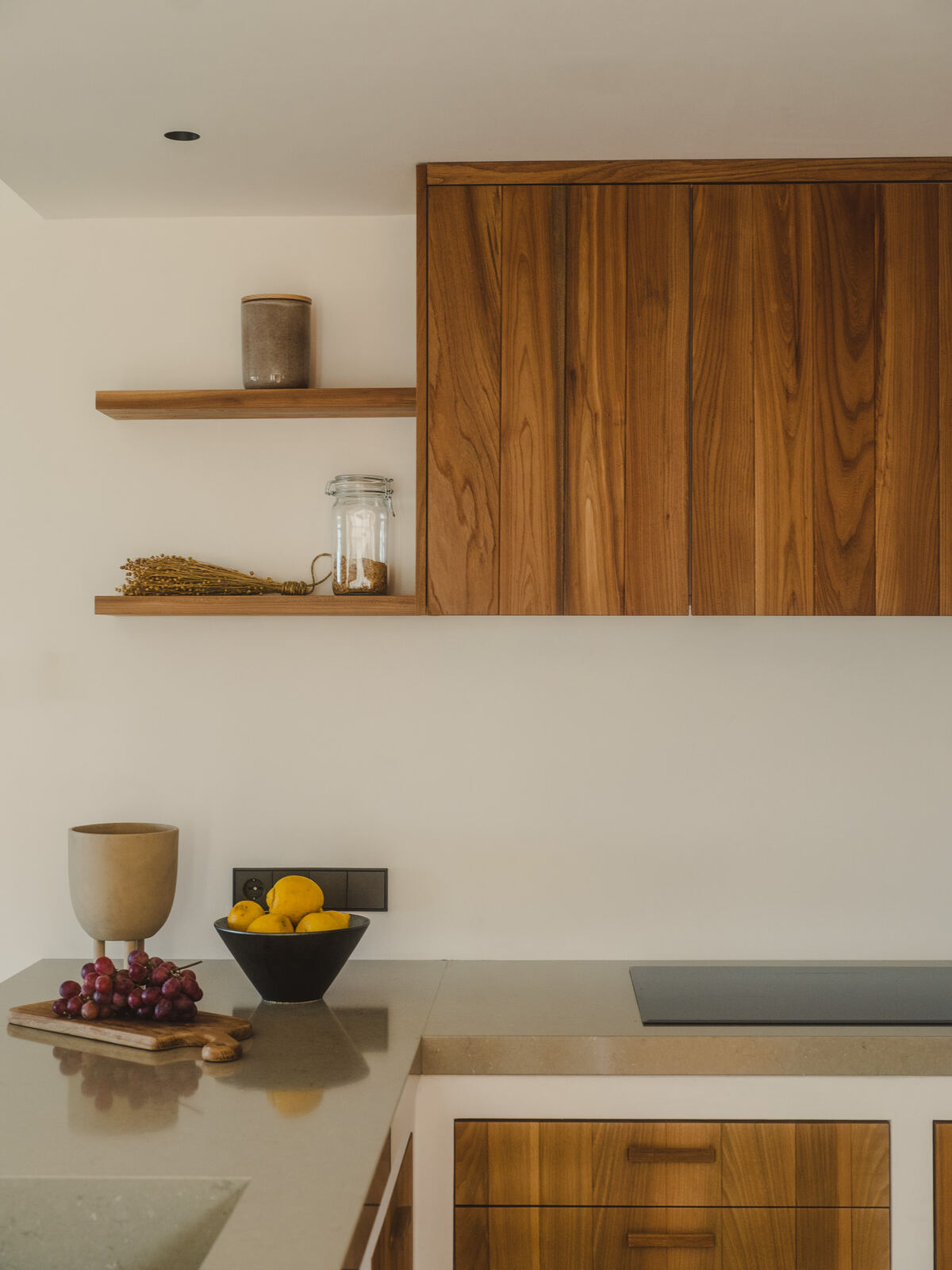 Kitchen detail with floating timber shelf and stone benchtop, Casa M