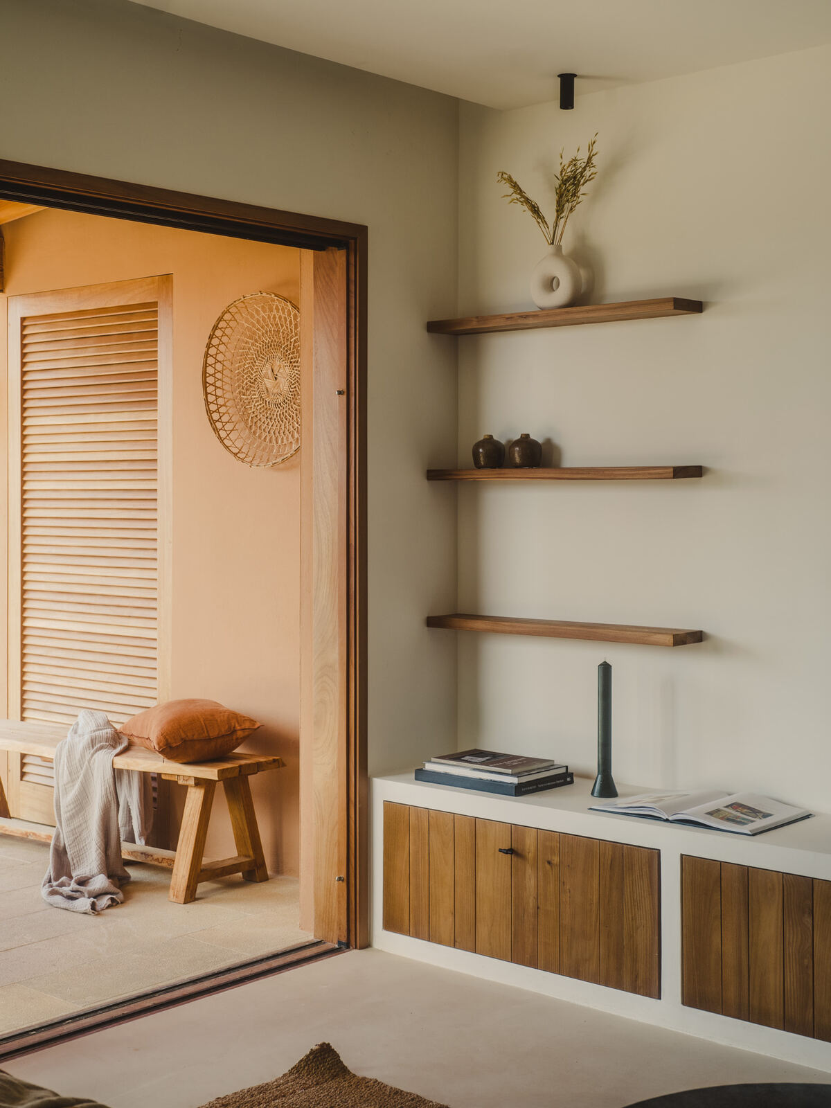 Living room joinery in warm timber with open shelving, Casa M