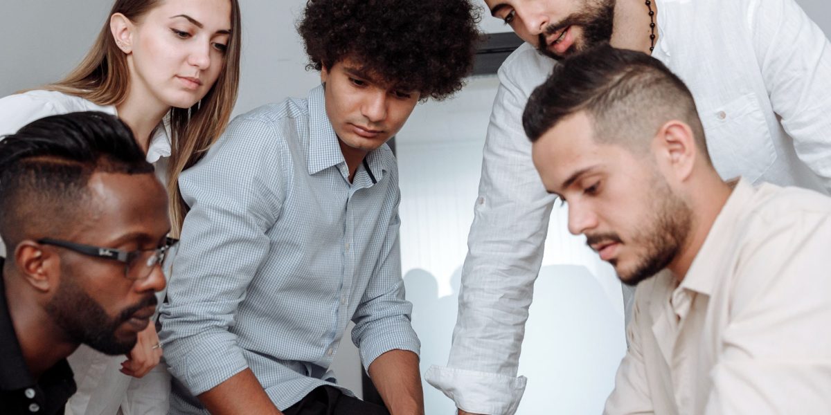 Professionals collaborate to understand and address the complexities of ethical AI development.