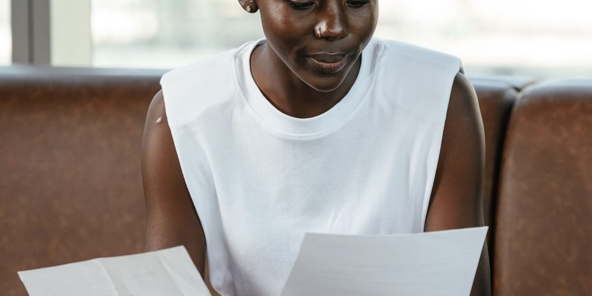 A confident professional reviewing documents, embodying accountability and careful decision-making in data analysis.