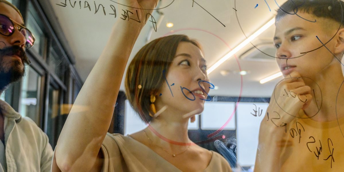 A group of designers collaborating on human-centered AI design and responsible innovation.