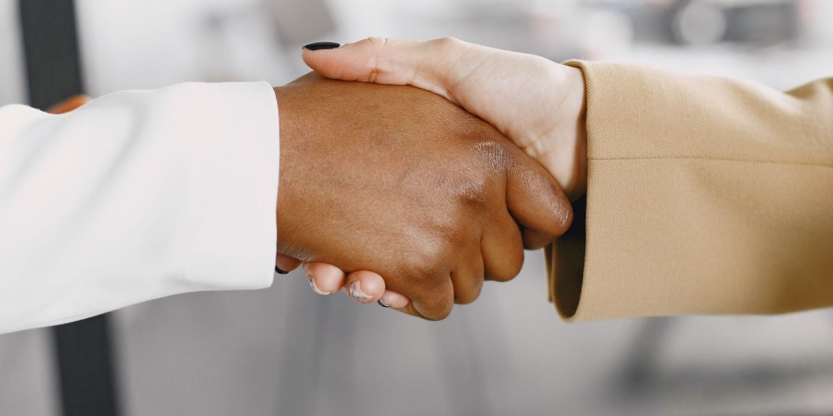 Professionals collaborating and establishing trust, emphasizing ethical partnerships in AI adoption.