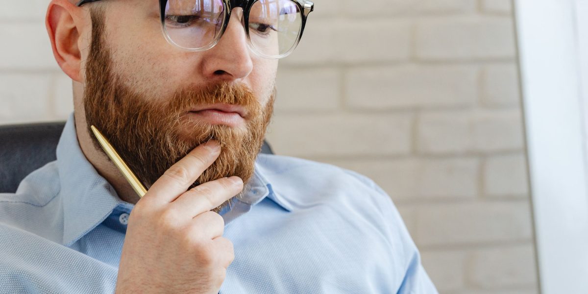 A person thoughtfully considering the implications of data privacy and synthetic drift in AI systems.