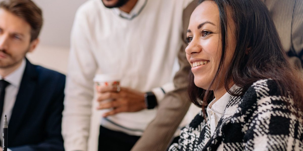 A diverse team collaborating effectively to overcome integration hurdles and deploy AI at scale.