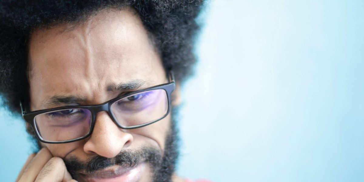 A person showing concern while reviewing digital information, reflecting growing distrust in AI-generated content.