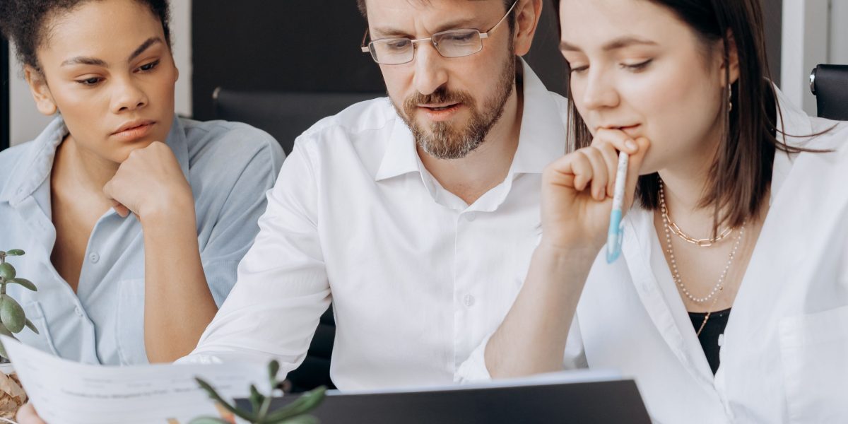 A diverse team collaborating and building together, symbolizing the collective commitment required from both employers and individuals to foster trustworthy AI careers.