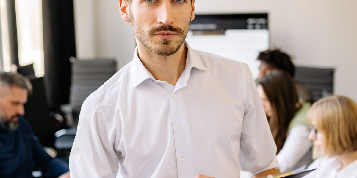 A business leader thoughtfully considering future strategies, embodying the need for accurate predictions in decision-making.