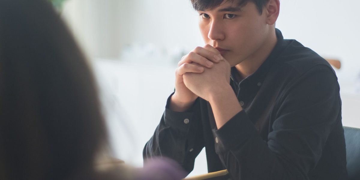 An interviewer and candidate engaged in a deep discussion, focusing on ethical considerations in AI.