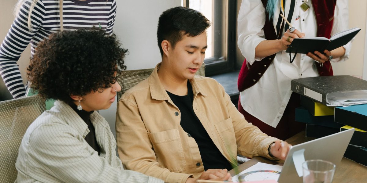 A diverse team collaborating to establish ethical guidelines for AI development and data usage.