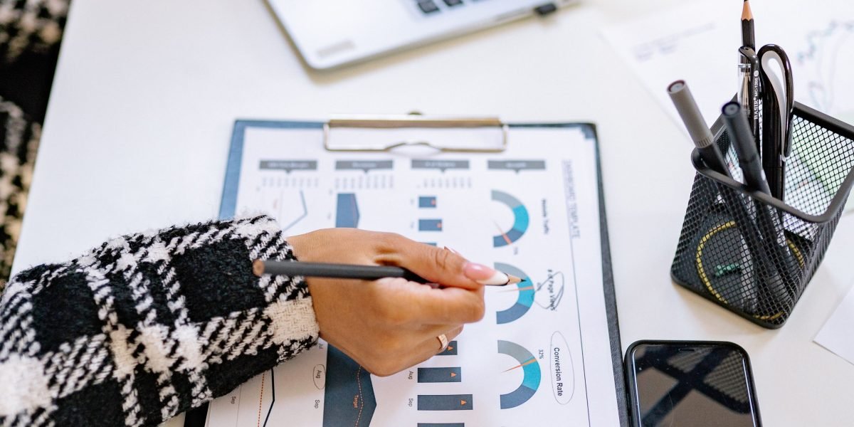 A person organizing and reviewing documents, representing the careful management of data inputs for AI systems.