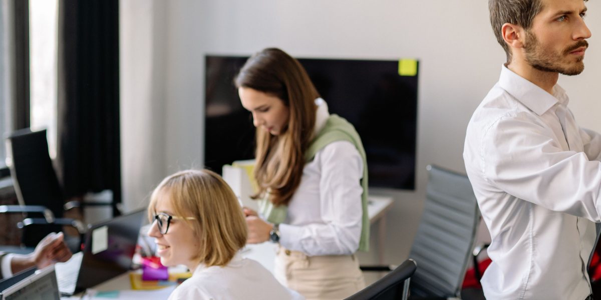 Professionals collaborating in a modern office, representing the acquisition of new skills and knowledge in AI.