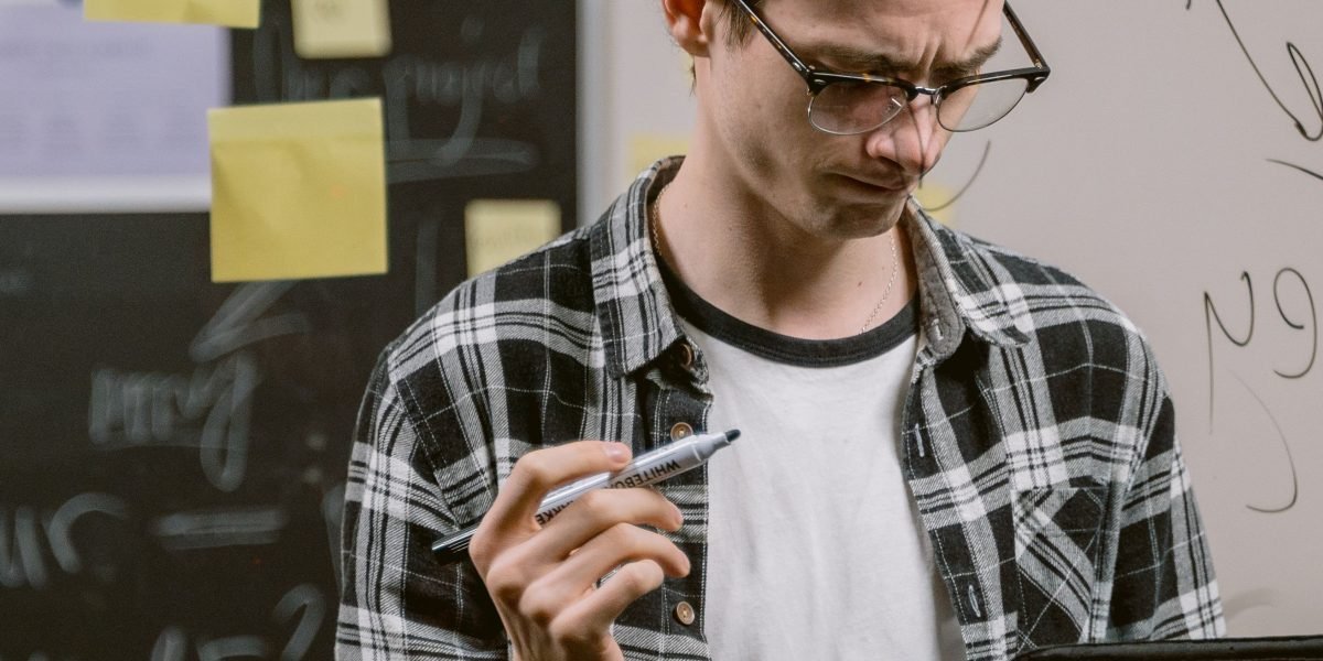 A person thoughtfully analyzing information, representing the detective-like role of a data analyst.