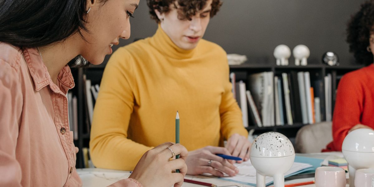 A team of designers and engineers collaborating on a new product, focusing on user experience and ethical design.