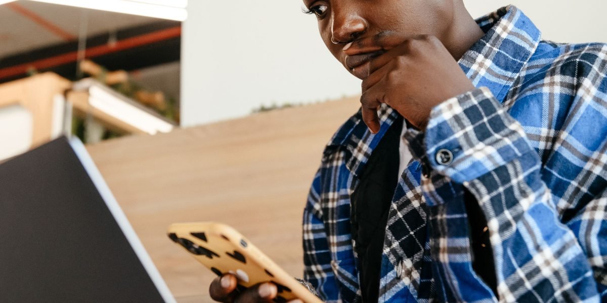 An individual appears thoughtful, reflecting on the reliability and trustworthiness of AI systems.