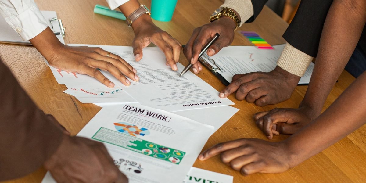 A diverse team actively collaborating and brainstorming ideas for a project.