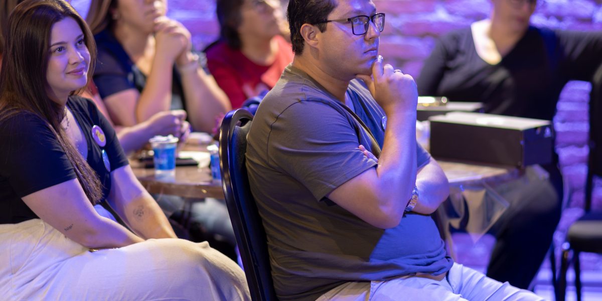 Individuals engaged in a training session or workshop, highlighting the role of human-centered defenses and continuous learning in cybersecurity.