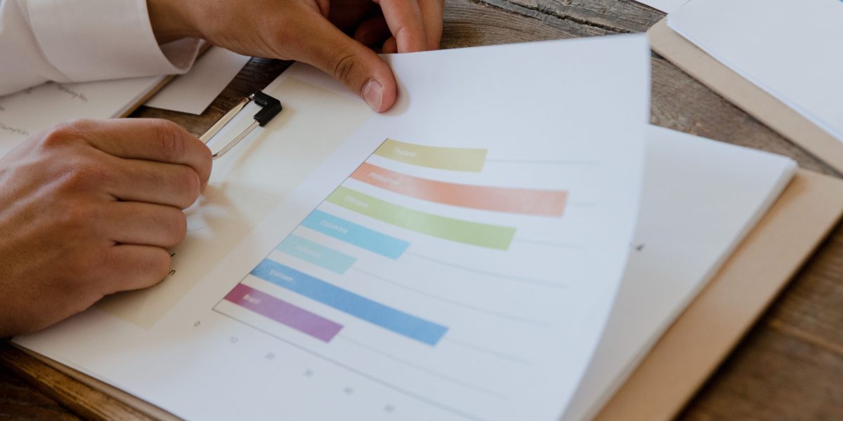 A person carefully reviewing a data quality report, emphasizing the continuous monitoring needed for AI-ready data.