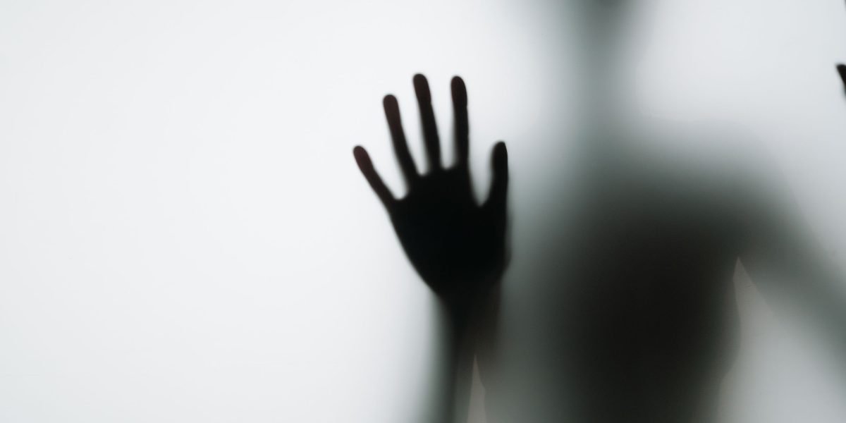 A person appears thoughtful or uncertain while engaging with digital content, symbolizing the 'synthetic drift' away from truth.