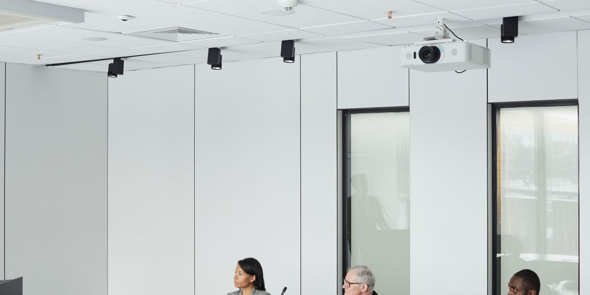 Business leaders engaged in a strategic discussion in a modern boardroom, focusing on ethical AI integration.