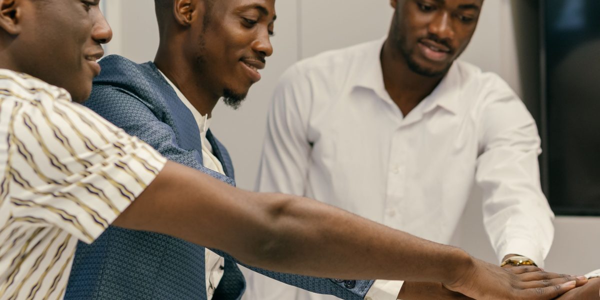 A diverse team collaborating and building consensus, representing the organizational commitment to ethical AI and trust.