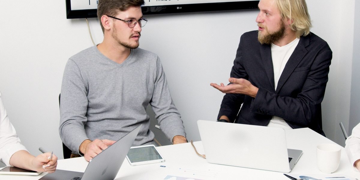 Professionals engaging in a discussion about responsible AI development and ethical data practices.