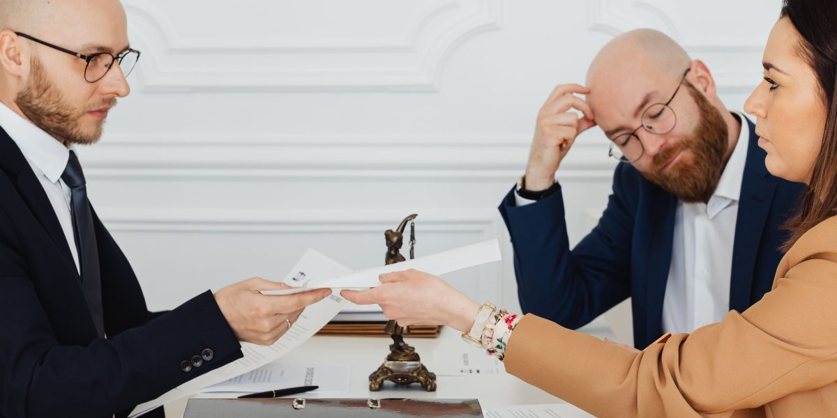 A legal team engaged in a serious discussion, representing the potential enforcement and penalties for deficient privacy notices.