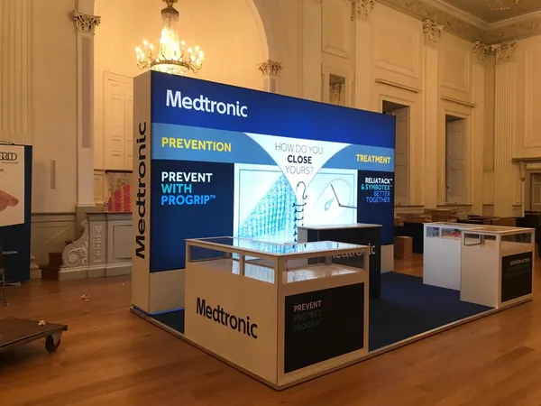 Modular lightbox stand with display cabinets in a ballroom venue