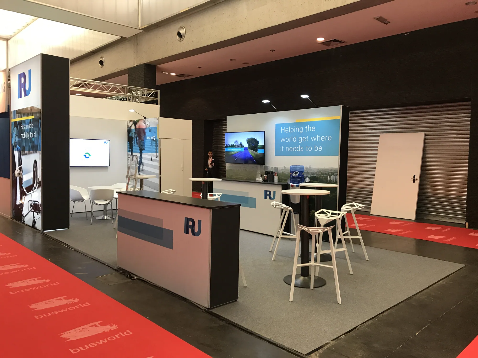 Modular stand with tall graphic tower, counter and screen