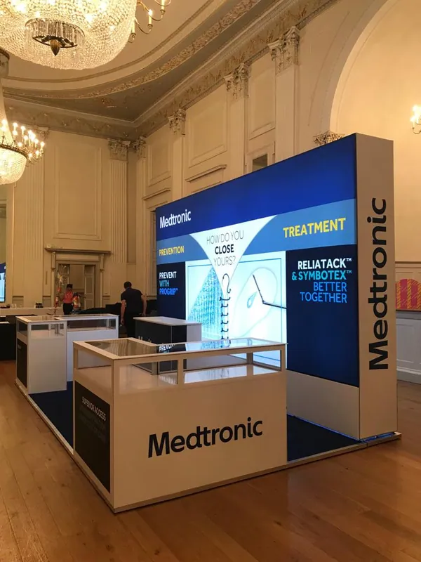 Side view of a modular lightbox stand with display cabinets