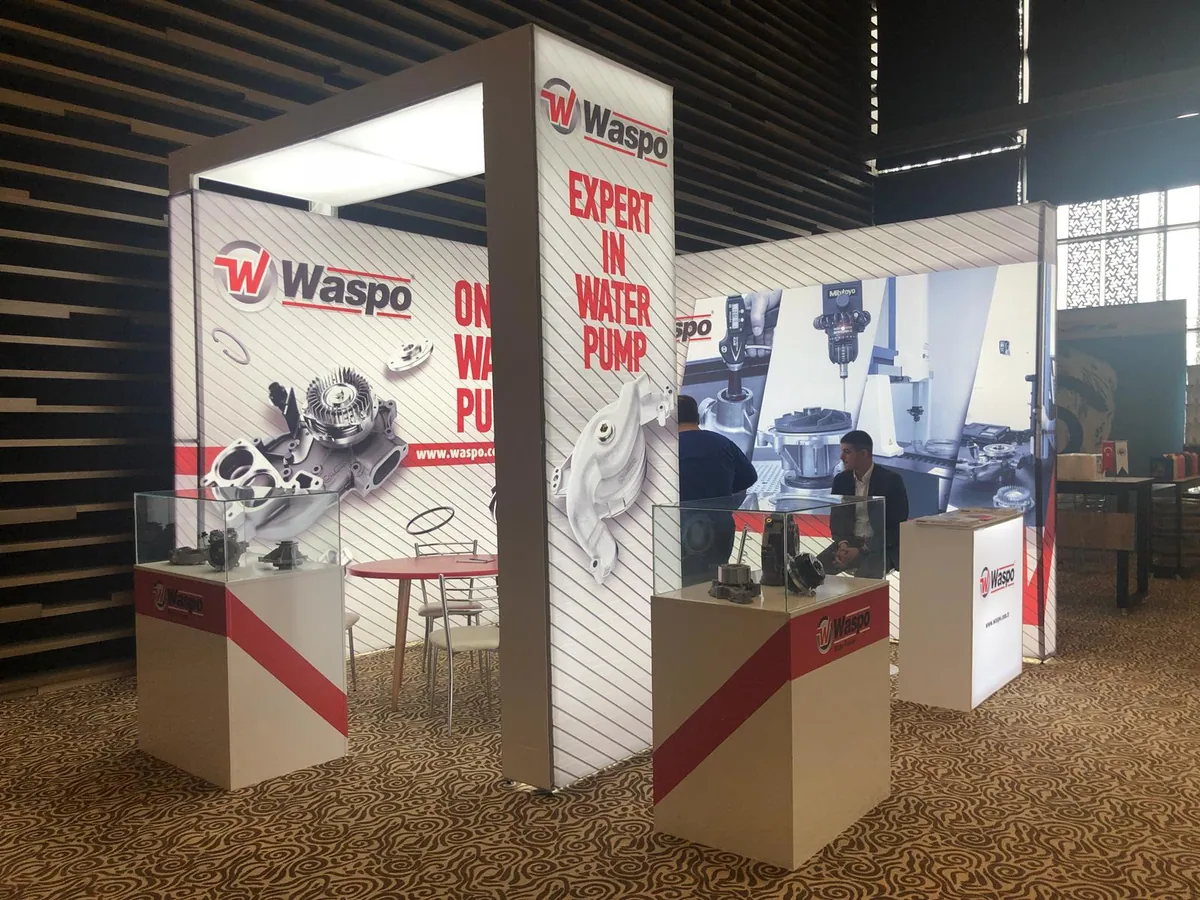 Modular stand with lightbox towers and product display plinths