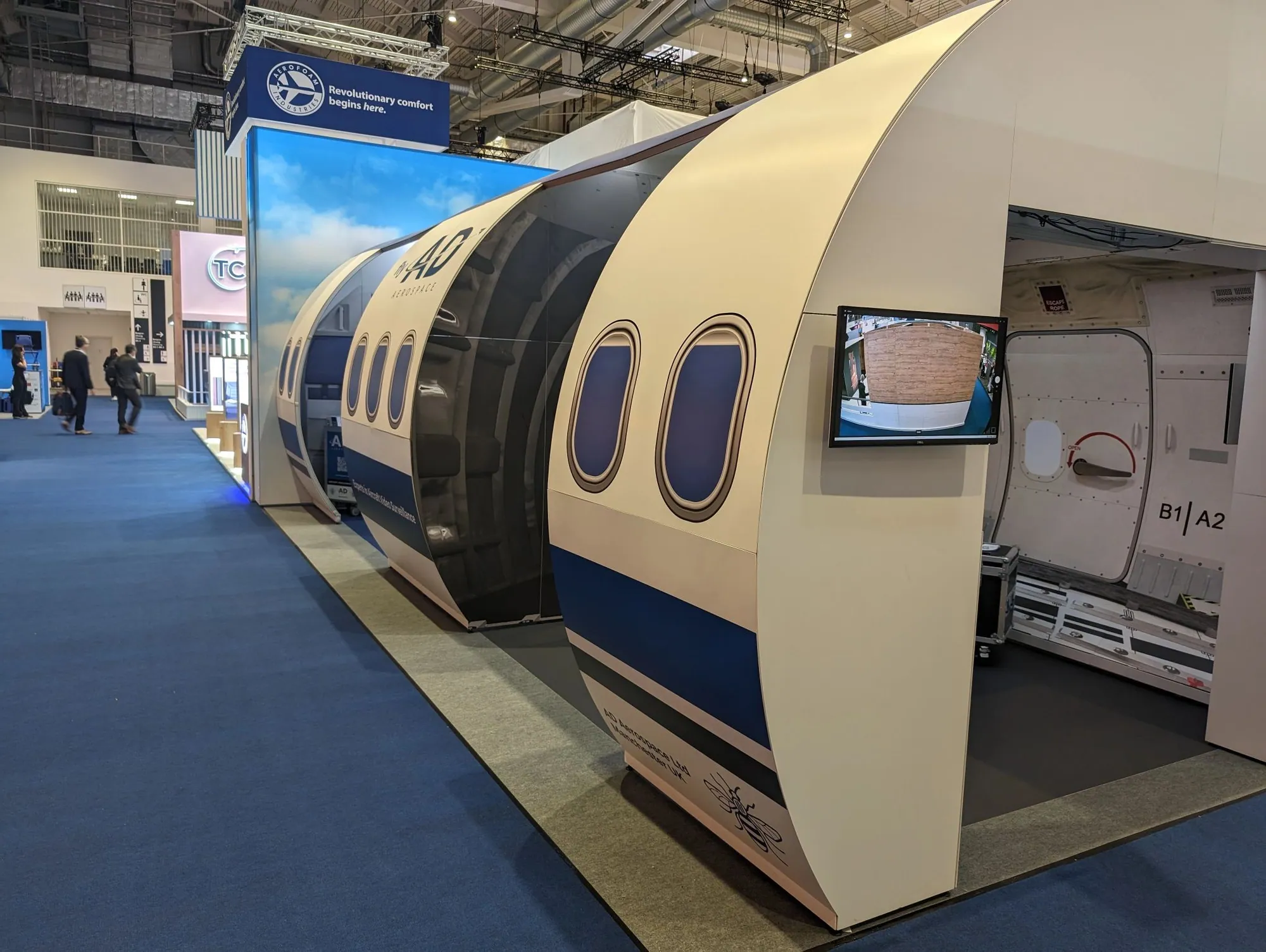 Aircraft fuselage themed custom exhibition stand built with T3 at an aerospace show