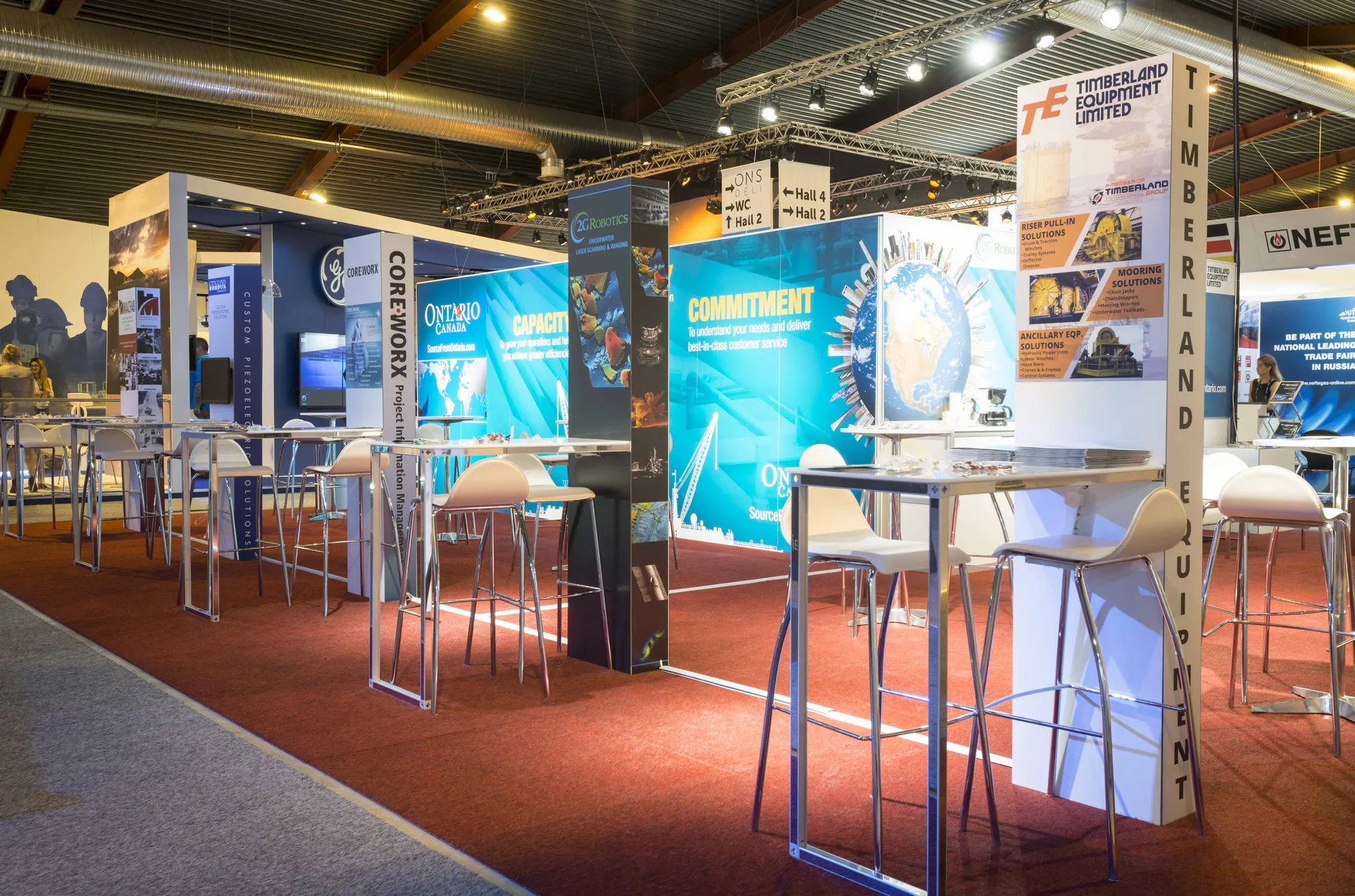 Multi-exhibitor pavilion built with T3 frames and poseur tables