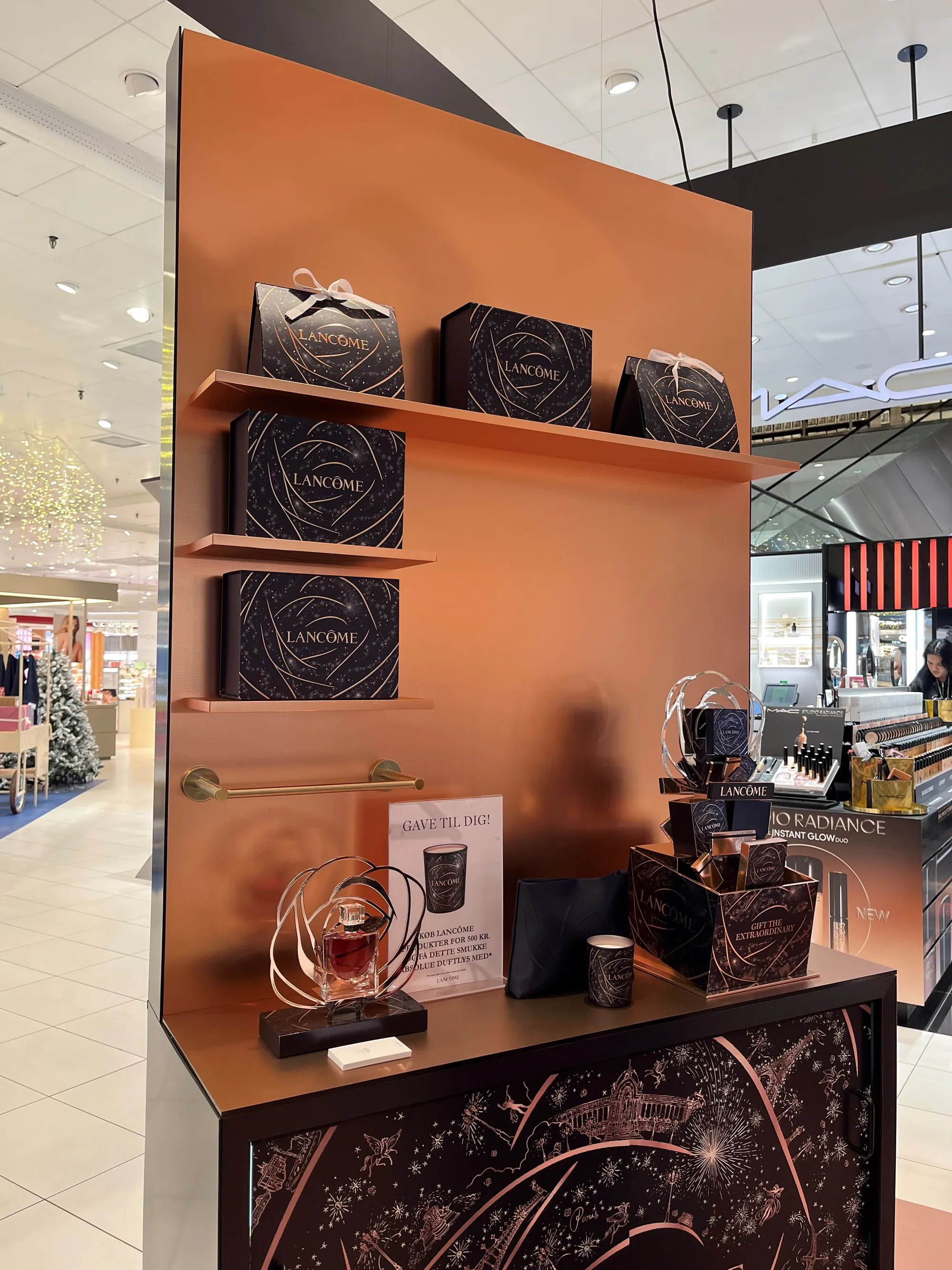 Copper-finish shelving wall with product display for a beauty pop-up